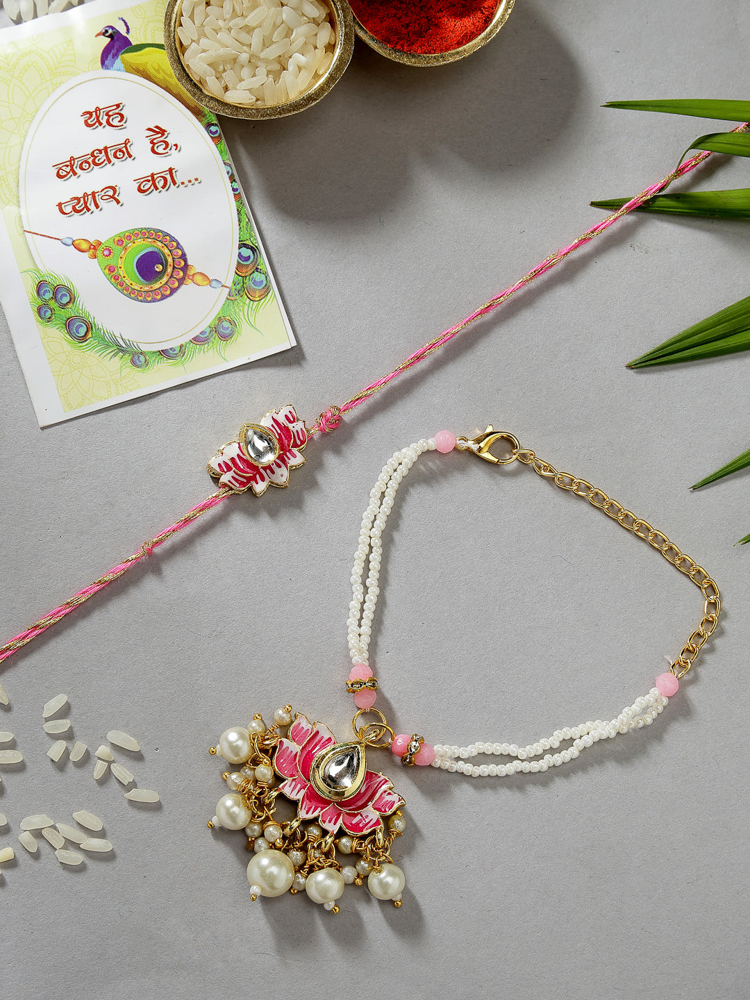 NVR Unisex Set of 2 Pink Lotus Shape Kundan-Studded & Beaded Wraparound Rakhi Set With Roli Chawal & Chocolate