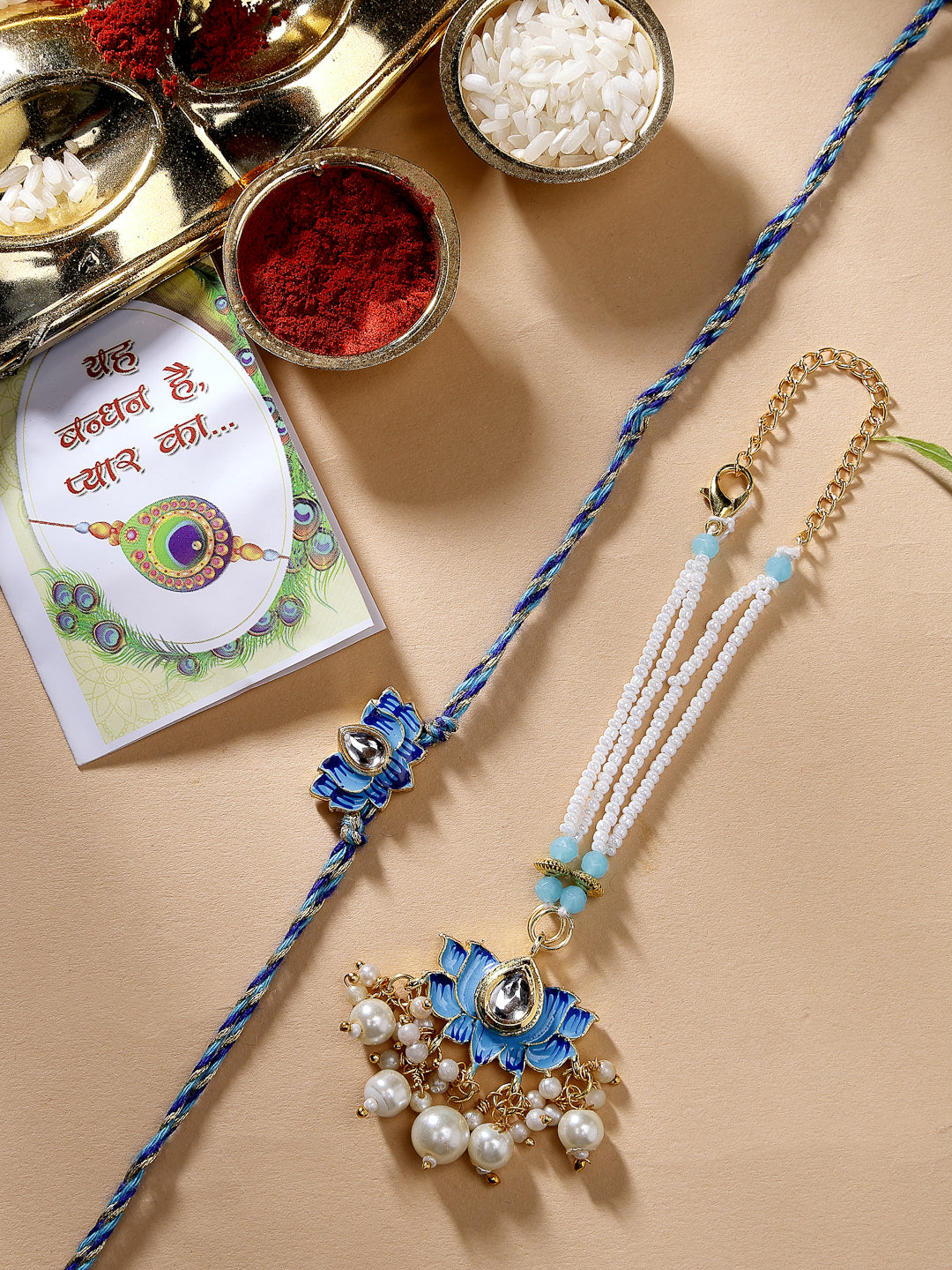 NVR Unisex Set of 2 Blue Lotus Shape Kundan-Studded & Beaded Handcrafted Wraparound Rakhi Set With Roli Chawal