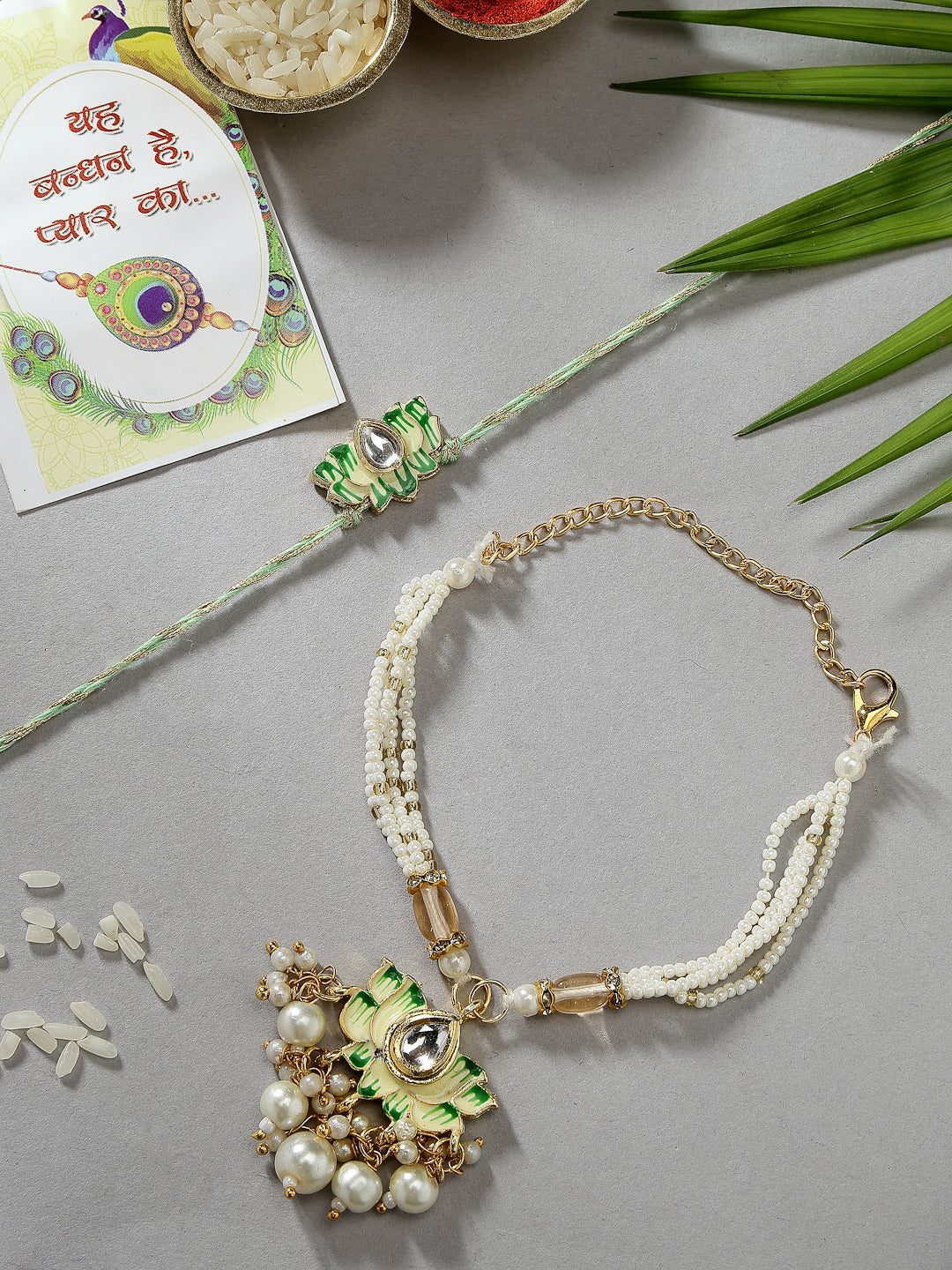 NVR Unisex Set of 2 Green Lotus Shape Kundan-Studded & Beaded Wraparound Rakhi Set With Roli Chawal & Chocolate