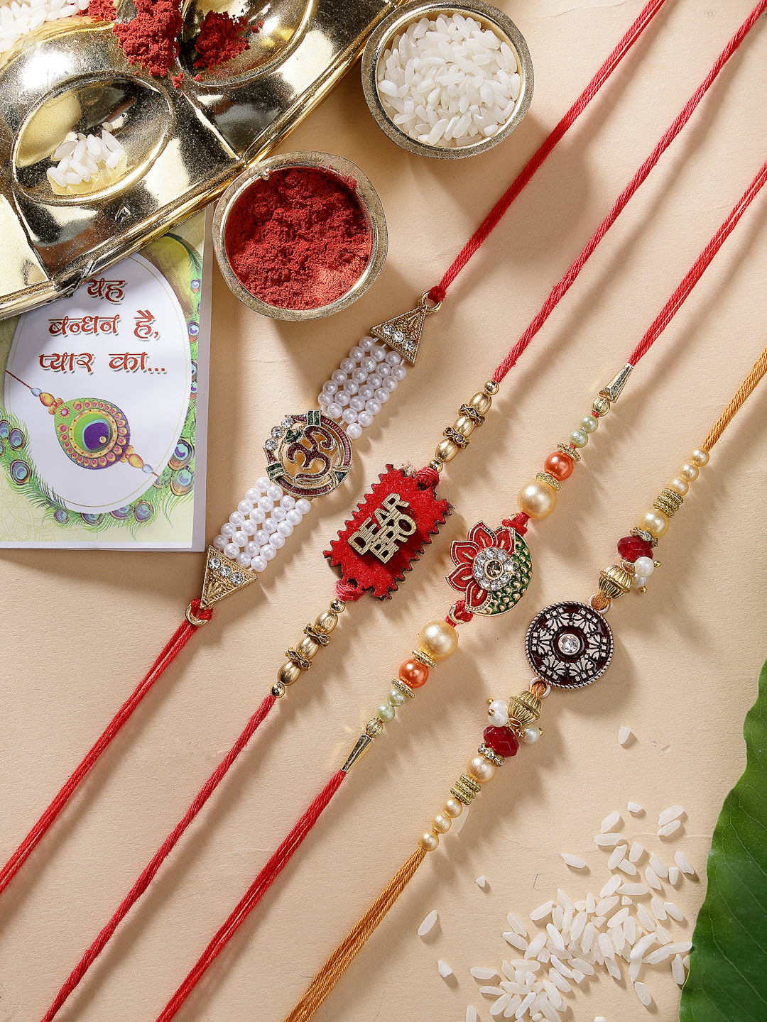 NVR Men Set of 4 Gold-Toned Stone-Studded & Beaded Rakhi With Roli Chawal & Chocolate