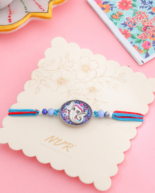 NVR Men Red & Blue Ganesh Ji Thread Rakhi with Roli Chawal Chandan & Mishri