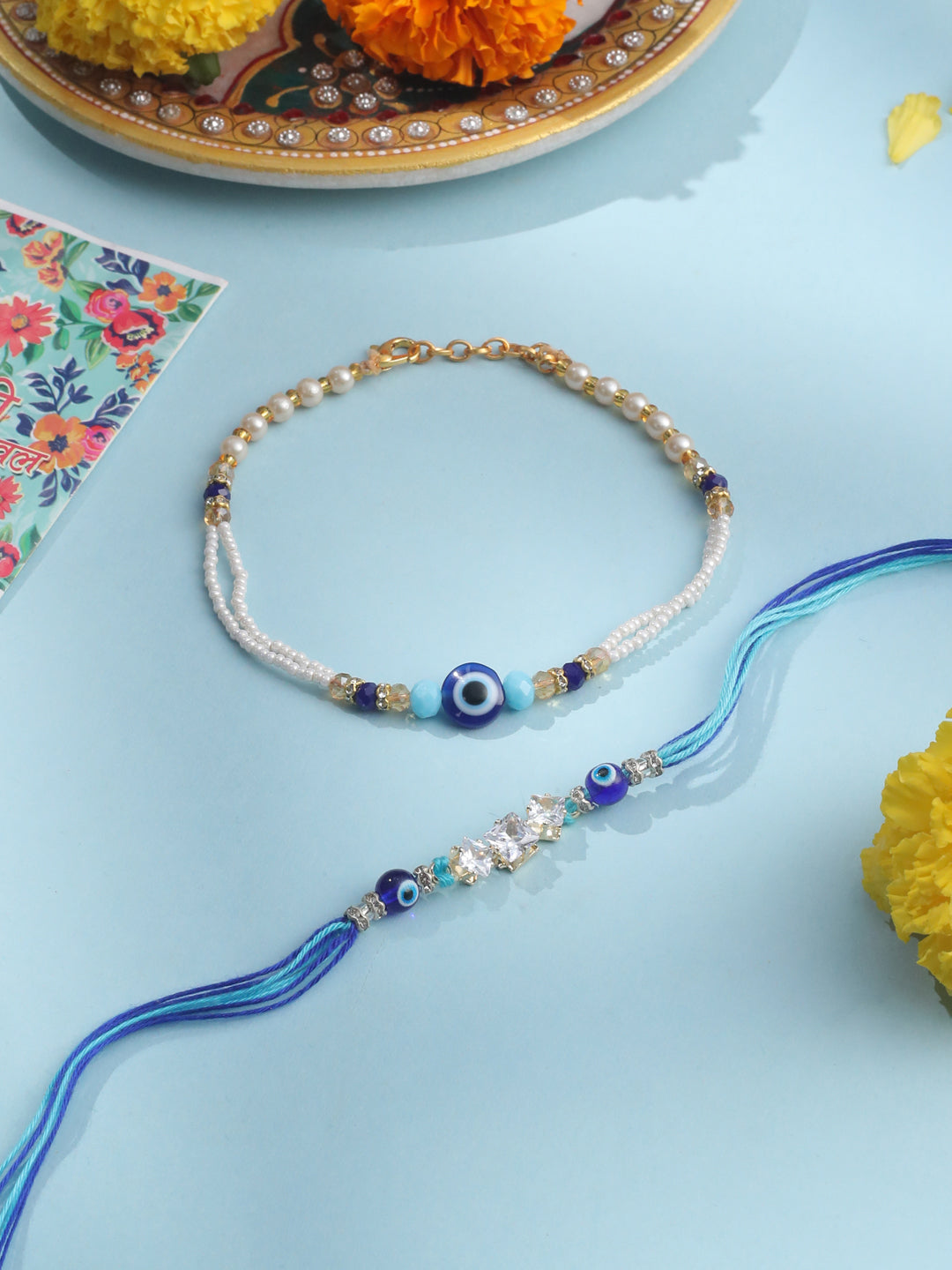 NVR Set of 2 Blue Evil Eye Artificial Stones & Beads Bhaiya Bhabhi Rakhi with Roli Chawal Chandan & Mishri