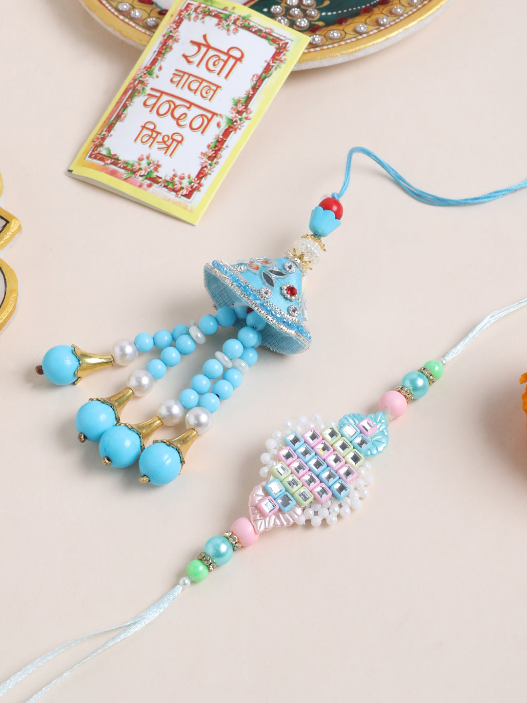 NVR Set of 2 Blue & Pink Artificial Stones & Beads Bhaiya Bhabhi Rakhi with Roli Chawal Chandan & Mishri
