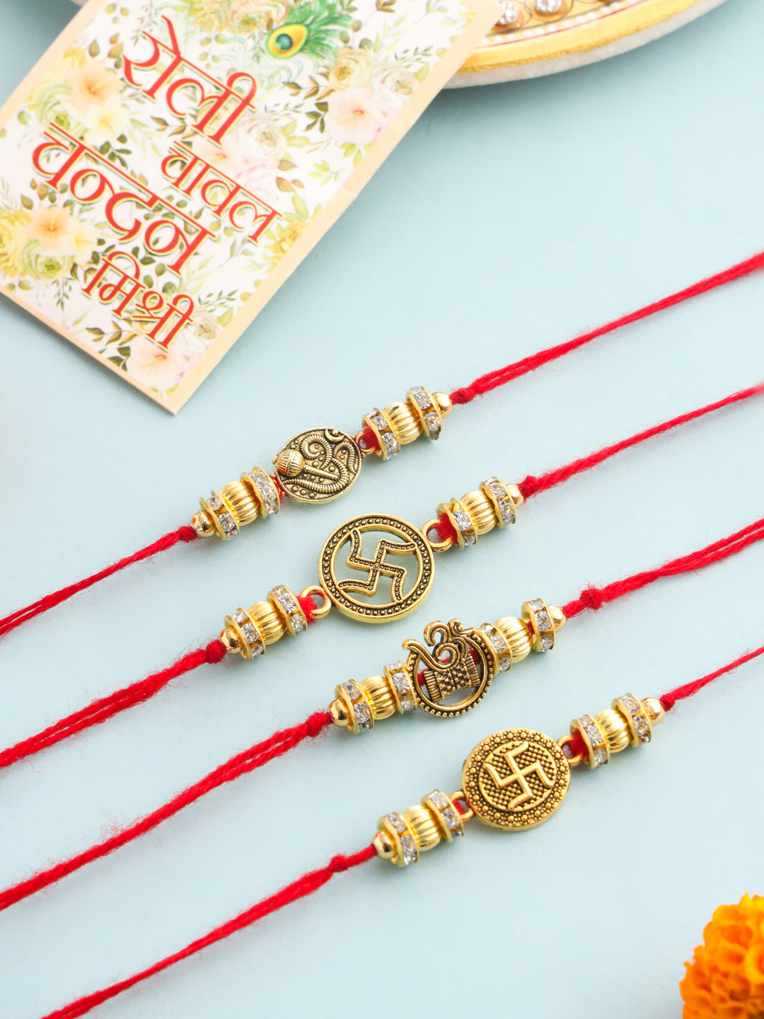 NVR Men Set of 4 Gold Toned Artificial Stones Swastik Design Thread Rakhi with Roli Chawal Chandan & Mishri