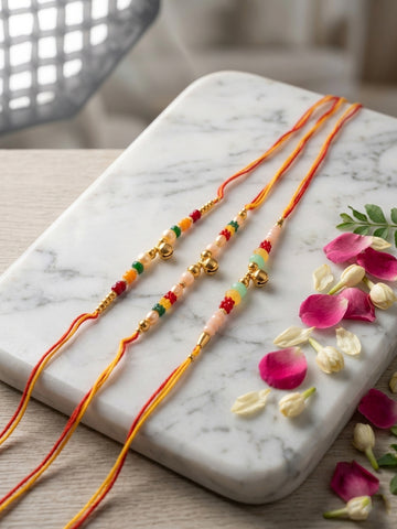 NVR Set of 3 Artificial Beads Orange Thread Rakhi With Roli Chawal Chandan Mishri
