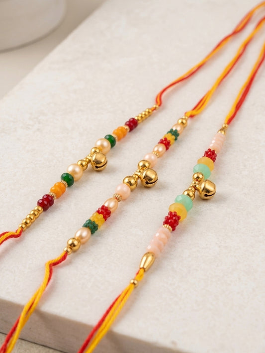 NVR Set of 3 Artificial Beads Orange Thread Rakhi With Roli Chawal Chandan Mishri