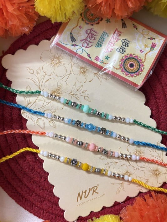 NVR Set of 4 Multicolor Artificial Beads Thread Rakhi with Roli Chawal Chandan Mishri