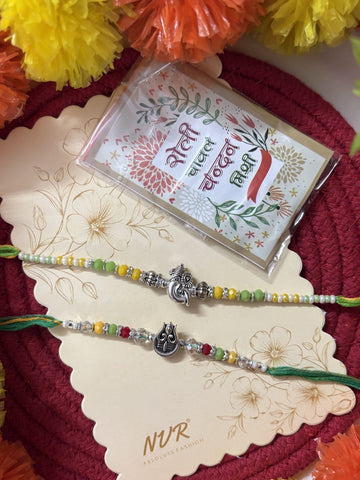 NVR Set of 2 Multicolor Religious Thread Rakhi with Roli Chawal Chandan Mishri