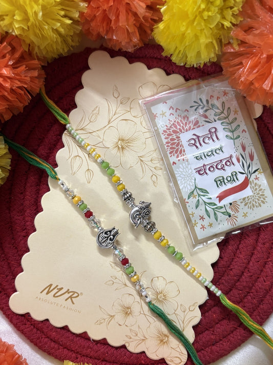 NVR Set of 2 Multicolor Religious Thread Rakhi with Roli Chawal Chandan Mishri