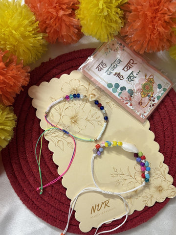 NVR Set of 2 Artificial Beads Thread Rakhi With Roli Chawal Chandan Mishri