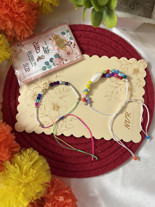 NVR Set of 2 Artificial Beads Thread Rakhi With Roli Chawal Chandan Mishri