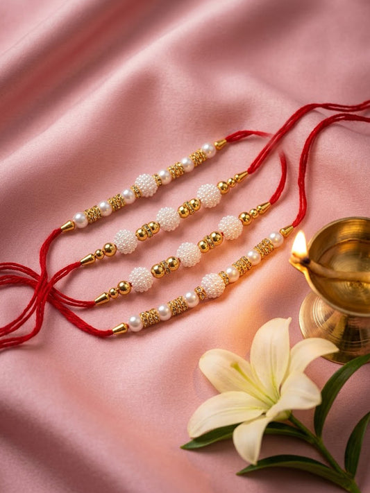 NVR Set of 4 White Pearls & Red Thread Rakhi With Roli Chawal Chandan Mishri