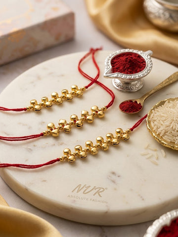 NVR Set of 3 Gold Toned Ghungroo & Red Thread Rakhi With Roli Chawal Chandan Mishri