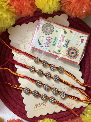 NVR Set of 4 Artificial Stones Floral Design Thread Rakhi with Roli Chawal Chandan Mishri