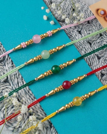 NVR Set of 5 Multi Artificial Beads Thread Rakhi with Roli Chawal Chandan Mishri