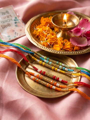 NVR Set of 6 Multi Artificial Beads Thread Rakhi with Roli Chawal Chandan Mishri