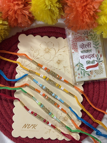 NVR Set of 6 Multi Artificial Beads Thread Rakhi with Roli Chawal Chandan Mishri