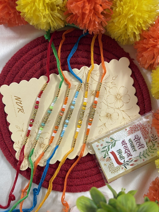 NVR Set of 6 Multi Artificial Beads Thread Rakhi with Roli Chawal Chandan Mishri