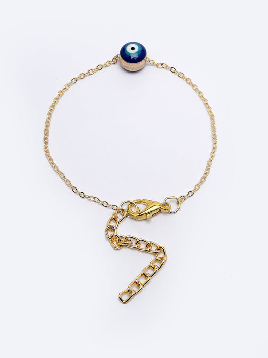 NVR Women Gold-Toned Evil Eye Rakhi With Roli Chawal