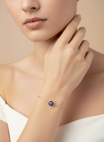 NVR Women Gold Toned Blue Evil Eye Charm Bracelet